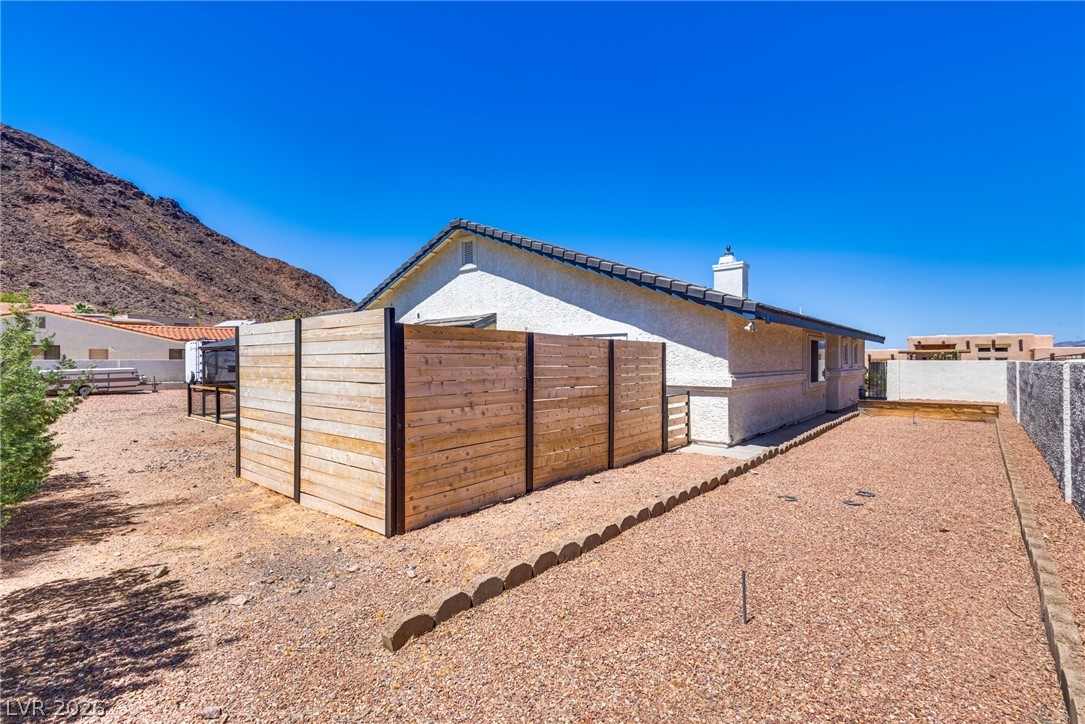 524 Swallow Cove Boulder City, NV 89005 - Photo 48 of 58 A private, desert-scaped yard offers ample space for outdoor living.