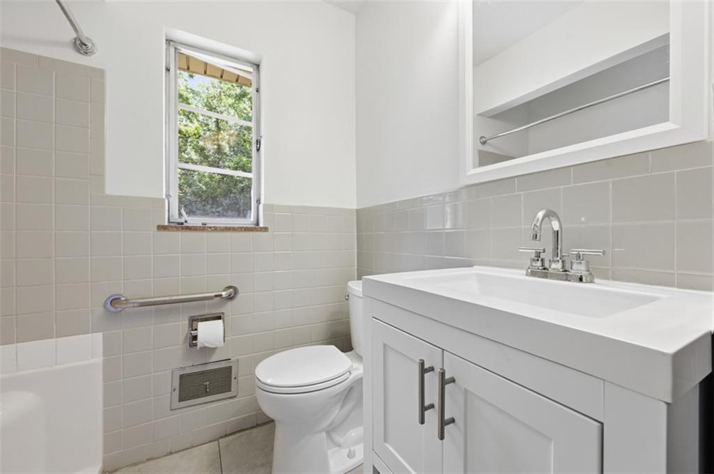 524 McElheny Road Glenshaw, PA 15116 - Photo 22 of 41 a bathroom with a sink a toilet and with mirror