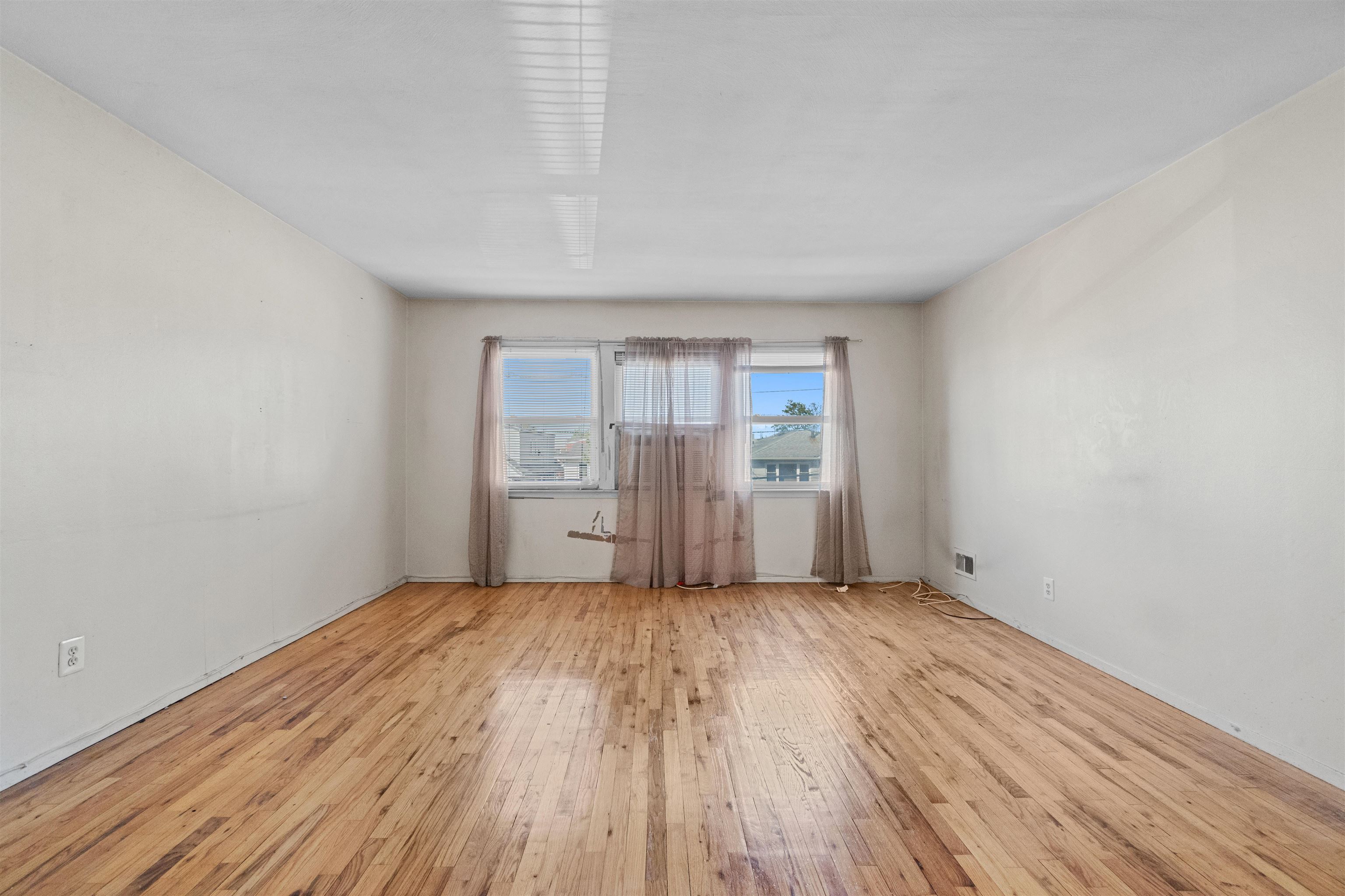 13 Crossgate Road Jersey City, NJ 07305 - Photo 13 of 36 a view of a room with wooden floor and window