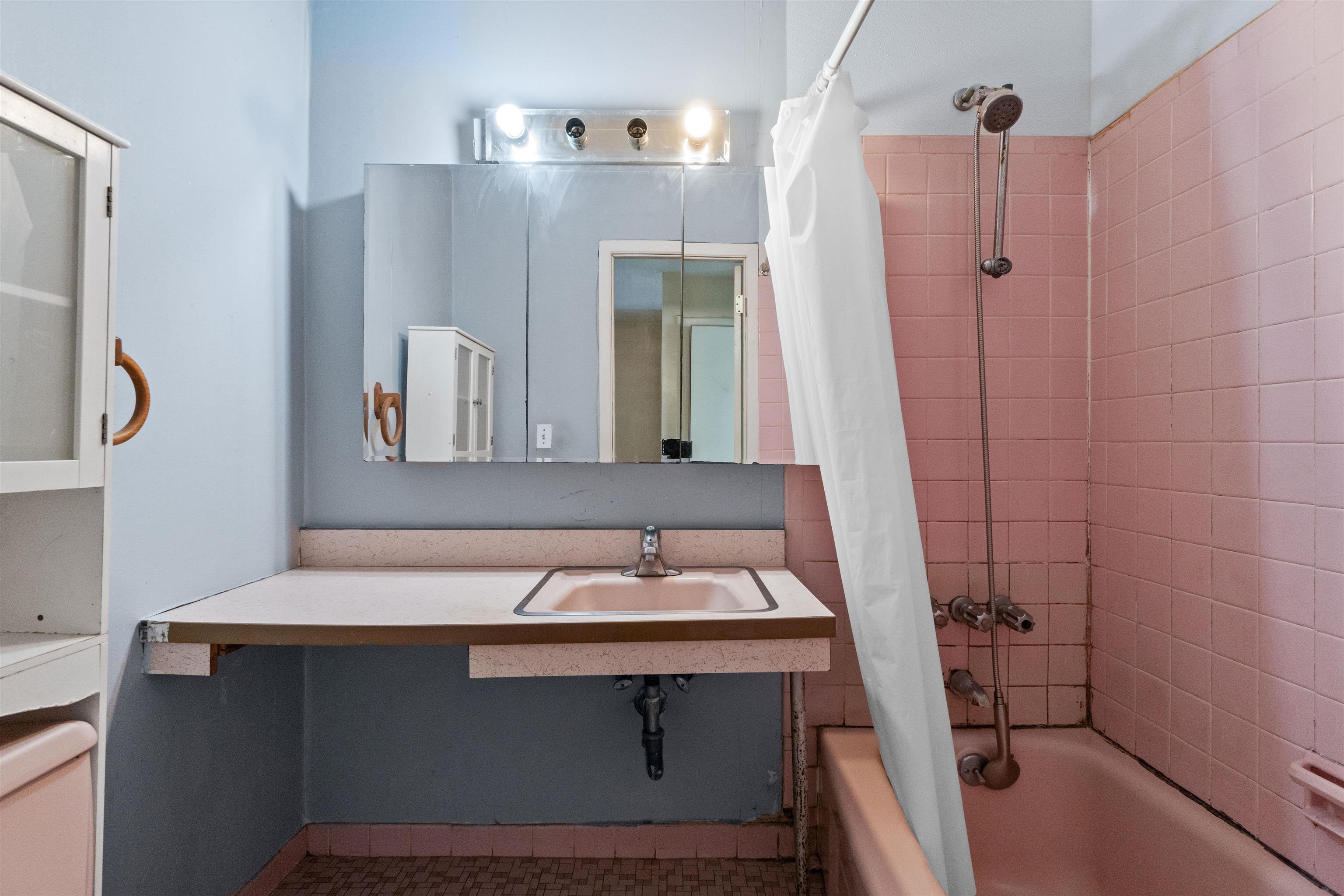 13 Crossgate Road Jersey City, NJ 07305 - Photo 18 of 36 a bathroom with a sink and a mirror