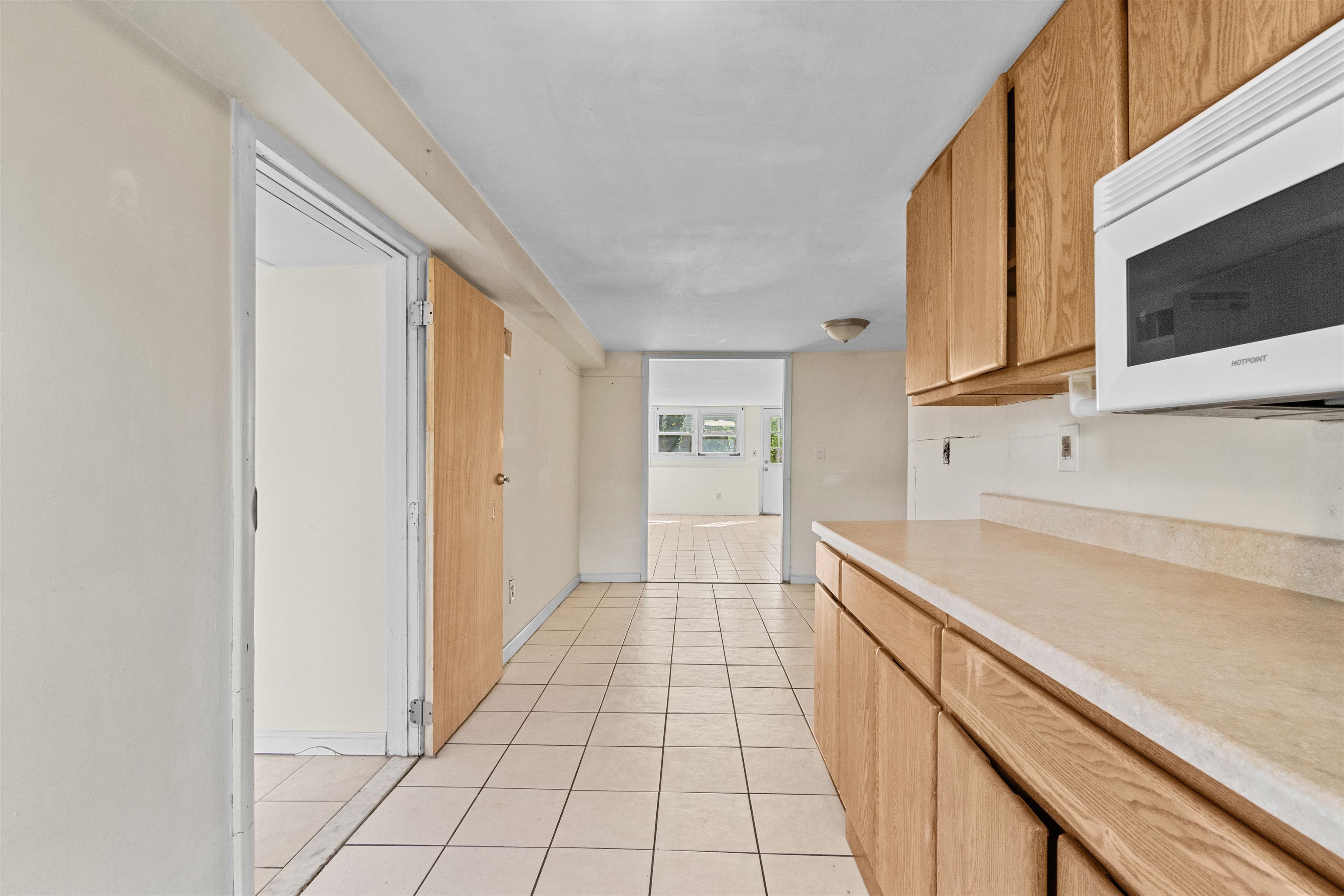 13 Crossgate Road Jersey City, NJ 07305 - Photo 26 of 36 a view of a kitchen with an empty space and a window