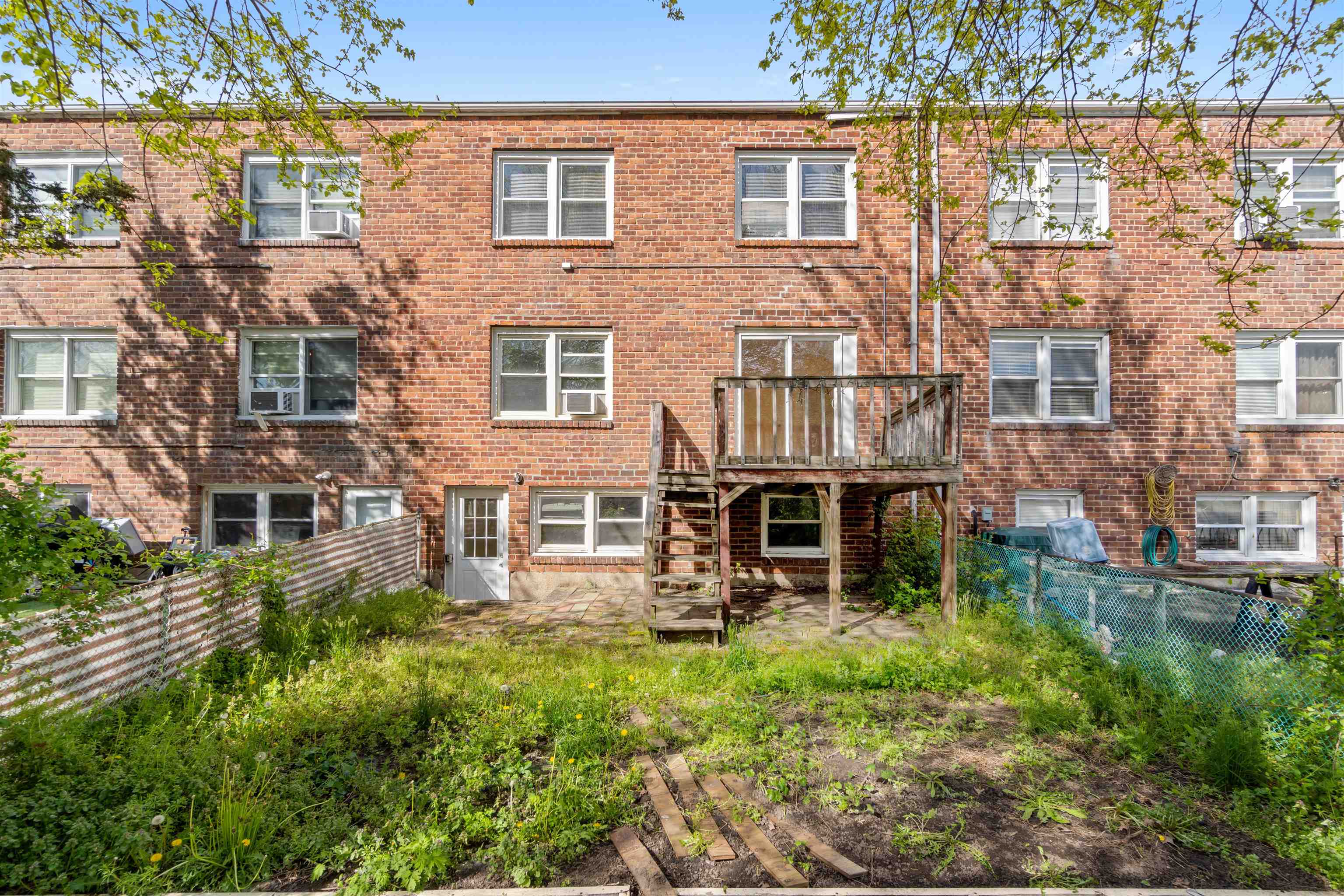 13 Crossgate Road Jersey City, NJ 07305 - Photo 35 of 36 an aerial view of a house with balcony and trees al around