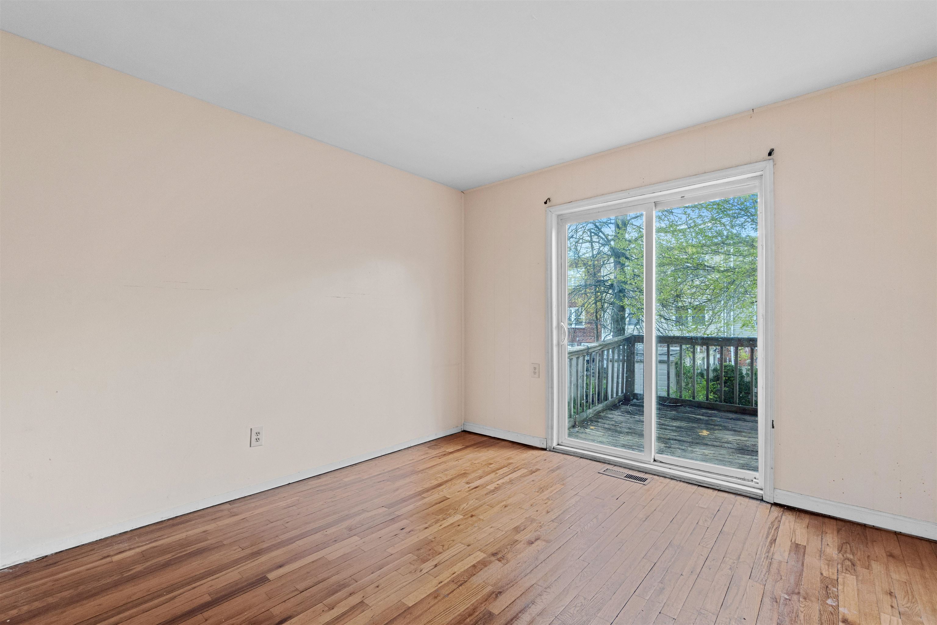 13 Crossgate Road Jersey City, NJ 07305 - Photo 10 of 36 a view of wooden floor and brick walls