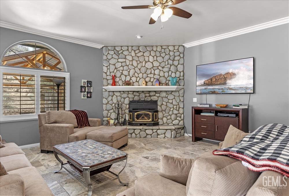 Undisclosed Address Tehachapi, CA 93561 - Photo 17 of 68 a living room with furniture a fireplace and a large window