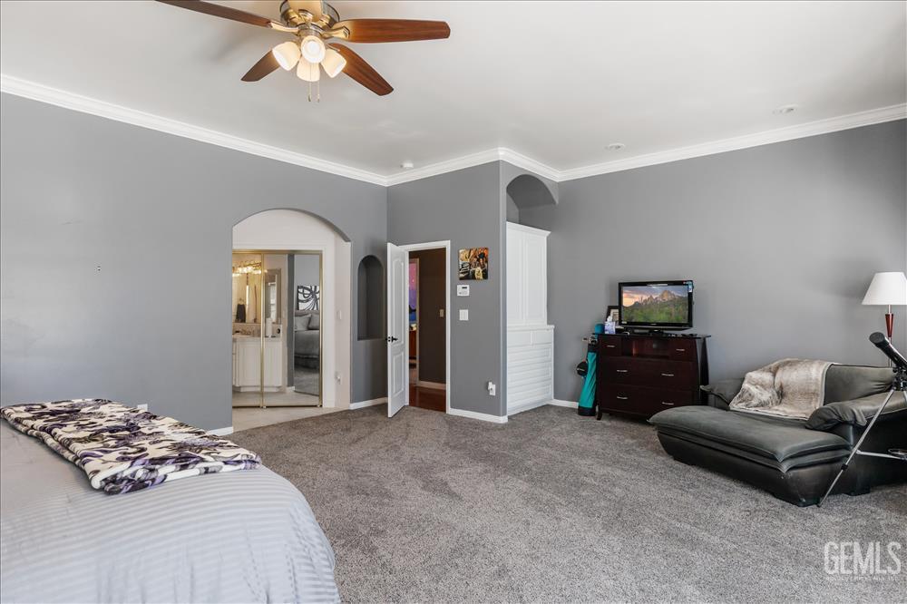 Undisclosed Address Tehachapi, CA 93561 - Photo 35 of 68 a bedroom with a bed and a chandelier