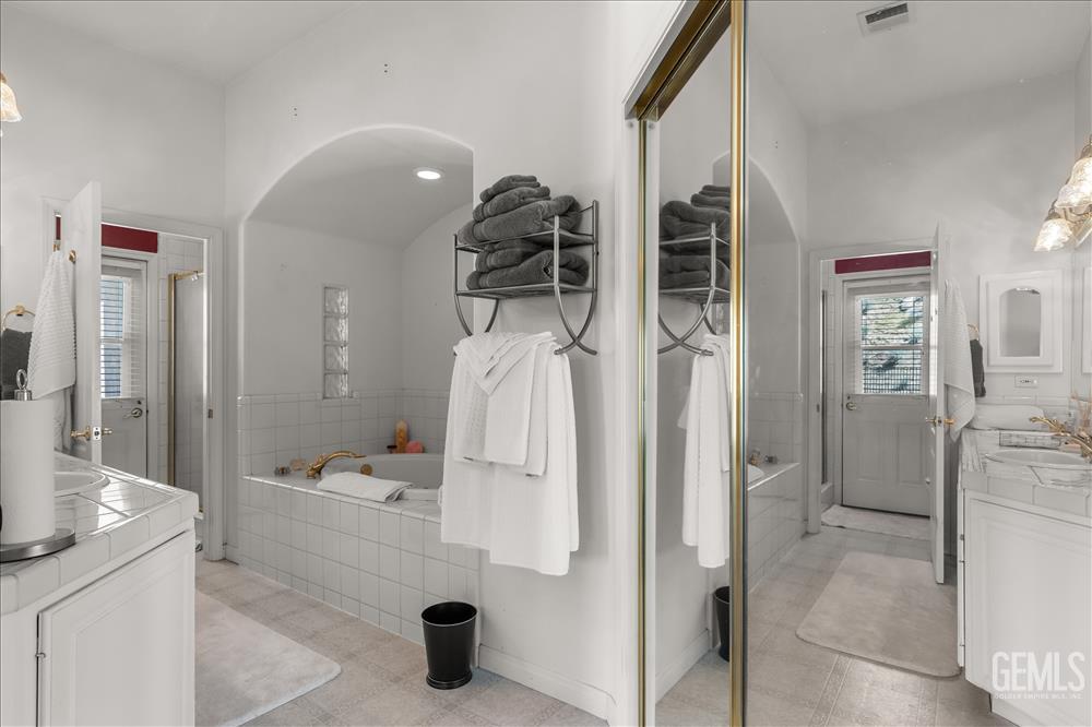 Undisclosed Address Tehachapi, CA 93561 - Photo 36 of 68 a bathroom with a tub sink shower and mirror