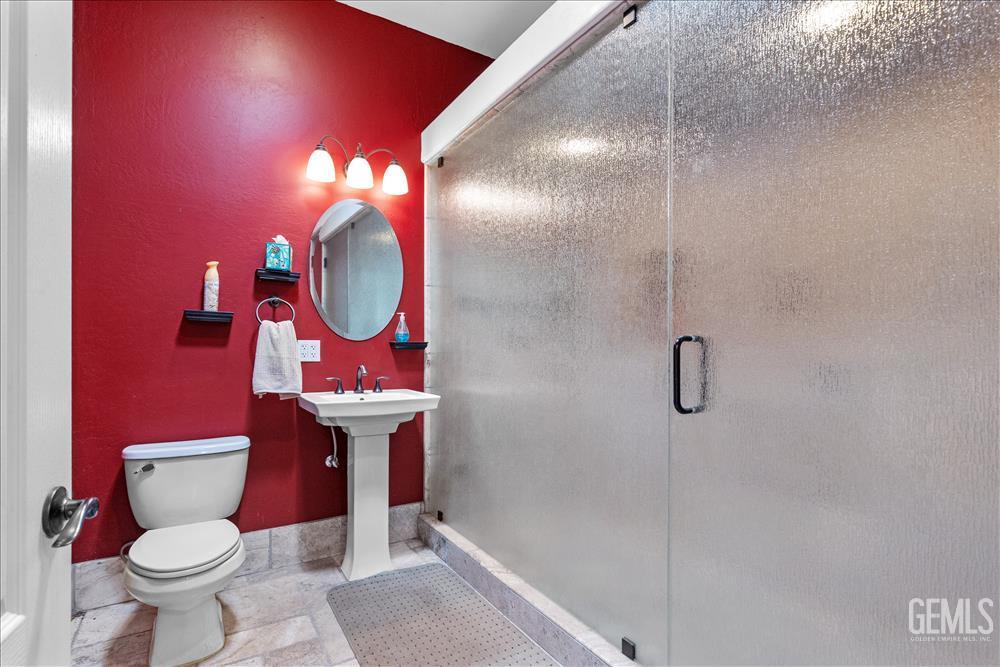 Undisclosed Address Tehachapi, CA 93561 - Photo 47 of 68 a bathroom with a sink mirror vanity and toilet