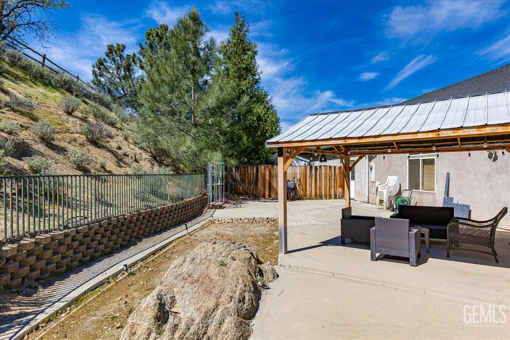 Undisclosed Address Tehachapi, CA 93561 - Photo 55 of 68 a patio with wooden table and chairs