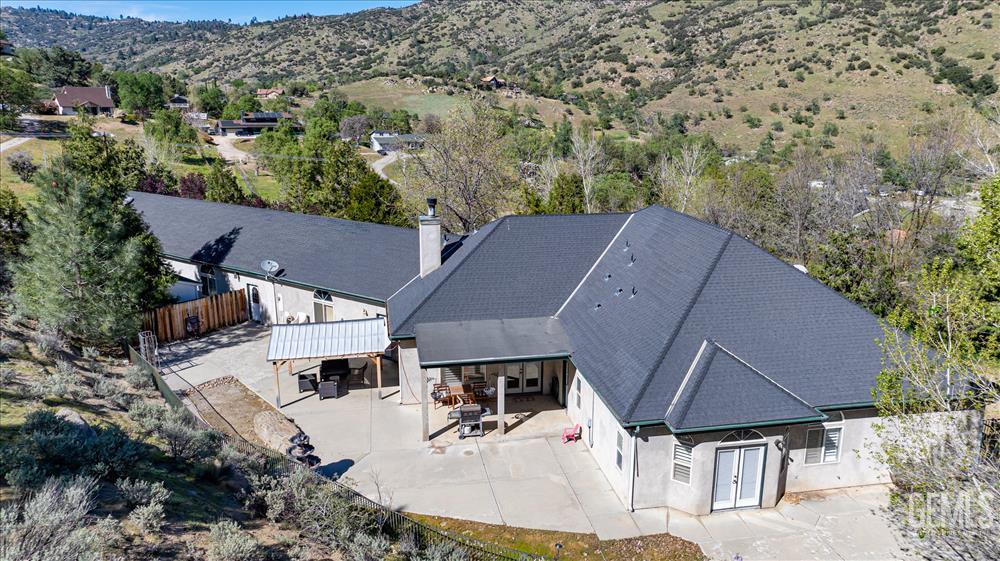 Undisclosed Address Tehachapi, CA 93561 - Photo 66 of 68 an aerial view of a house with yard and mountain view in back