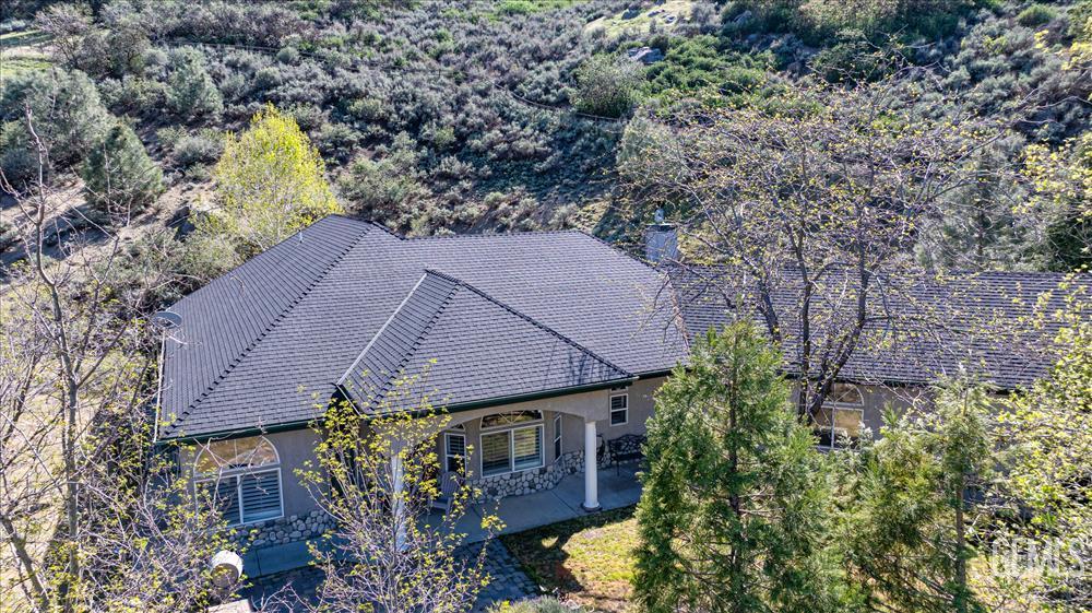 Undisclosed Address Tehachapi, CA 93561 - Photo 67 of 68 a aerial view of a house with swimming pool and trees