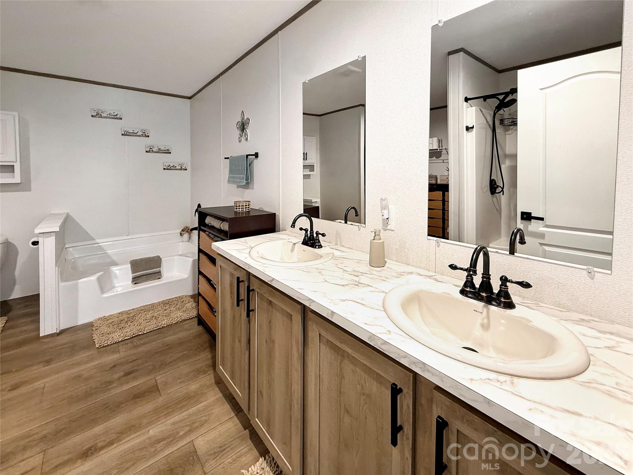 264 Fairchase Circle Stony Point, NC 28678 - Photo 12 of 24 a bathroom with a sink and a mirror
