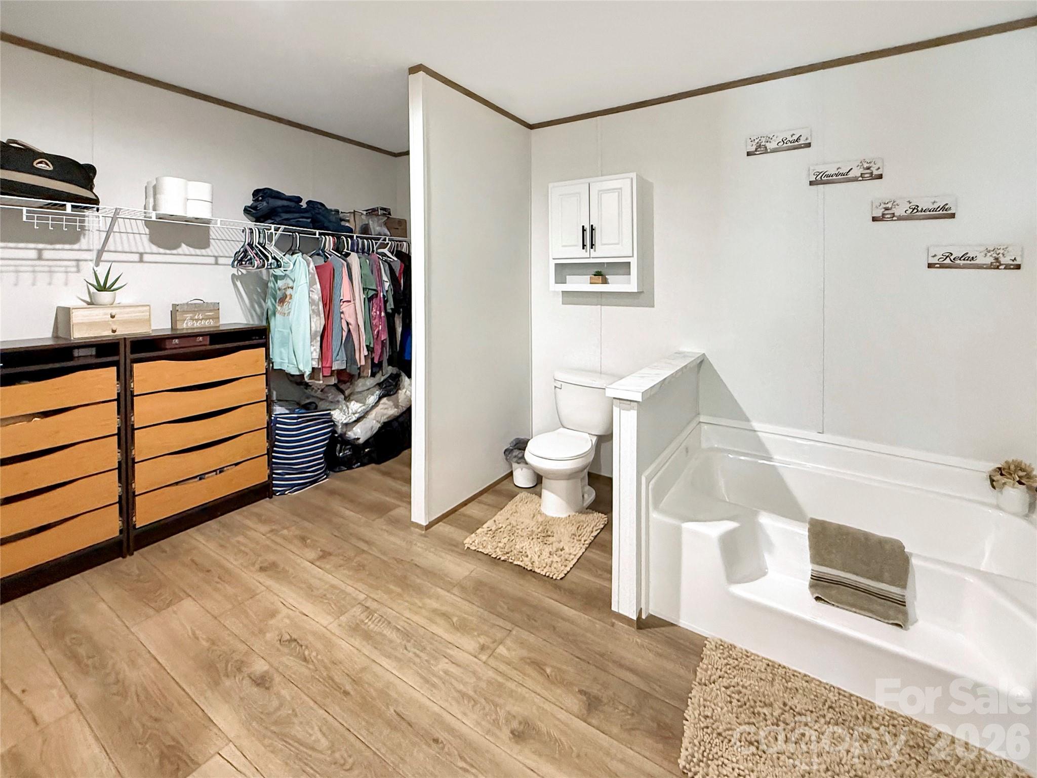 264 Fairchase Circle Stony Point, NC 28678 - Photo 14 of 24 a bedroom with a bed and a walk in closet