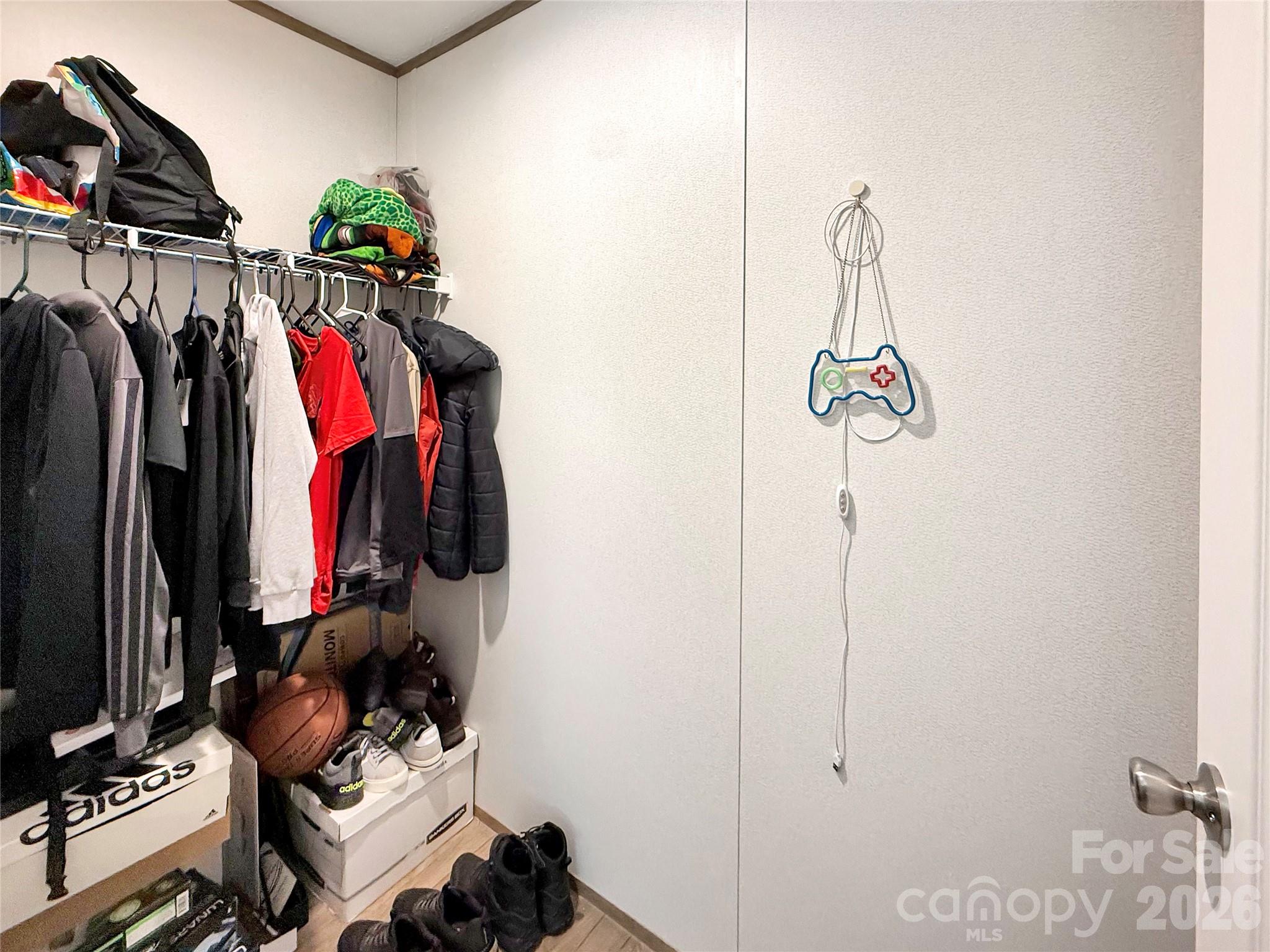 264 Fairchase Circle Stony Point, NC 28678 - Photo 16 of 24 a view of walk in closet with clothes and shoes