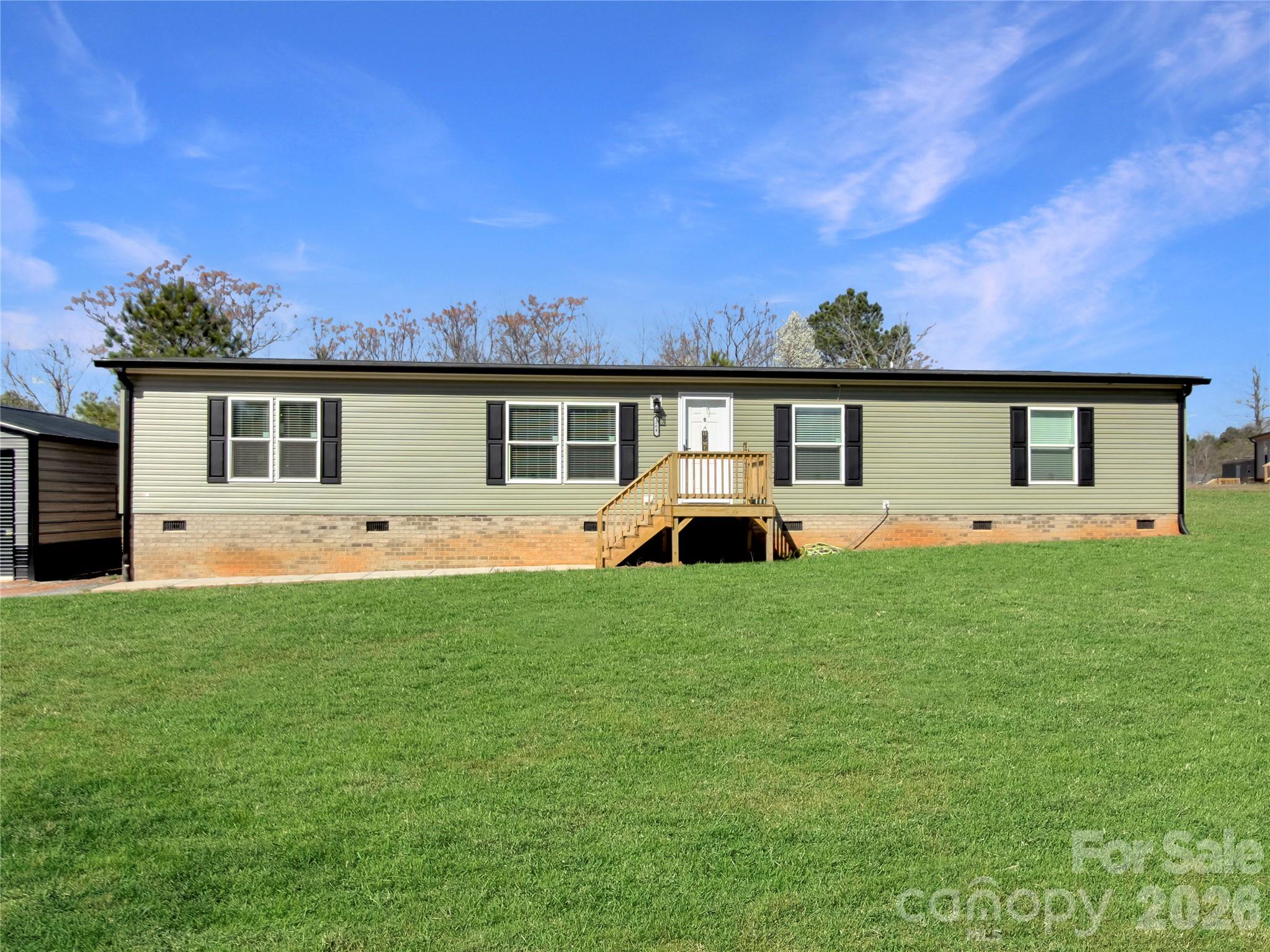 264 Fairchase Circle Stony Point, NC 28678 - Photo 2 of 24 a front view of house with yard and seating area