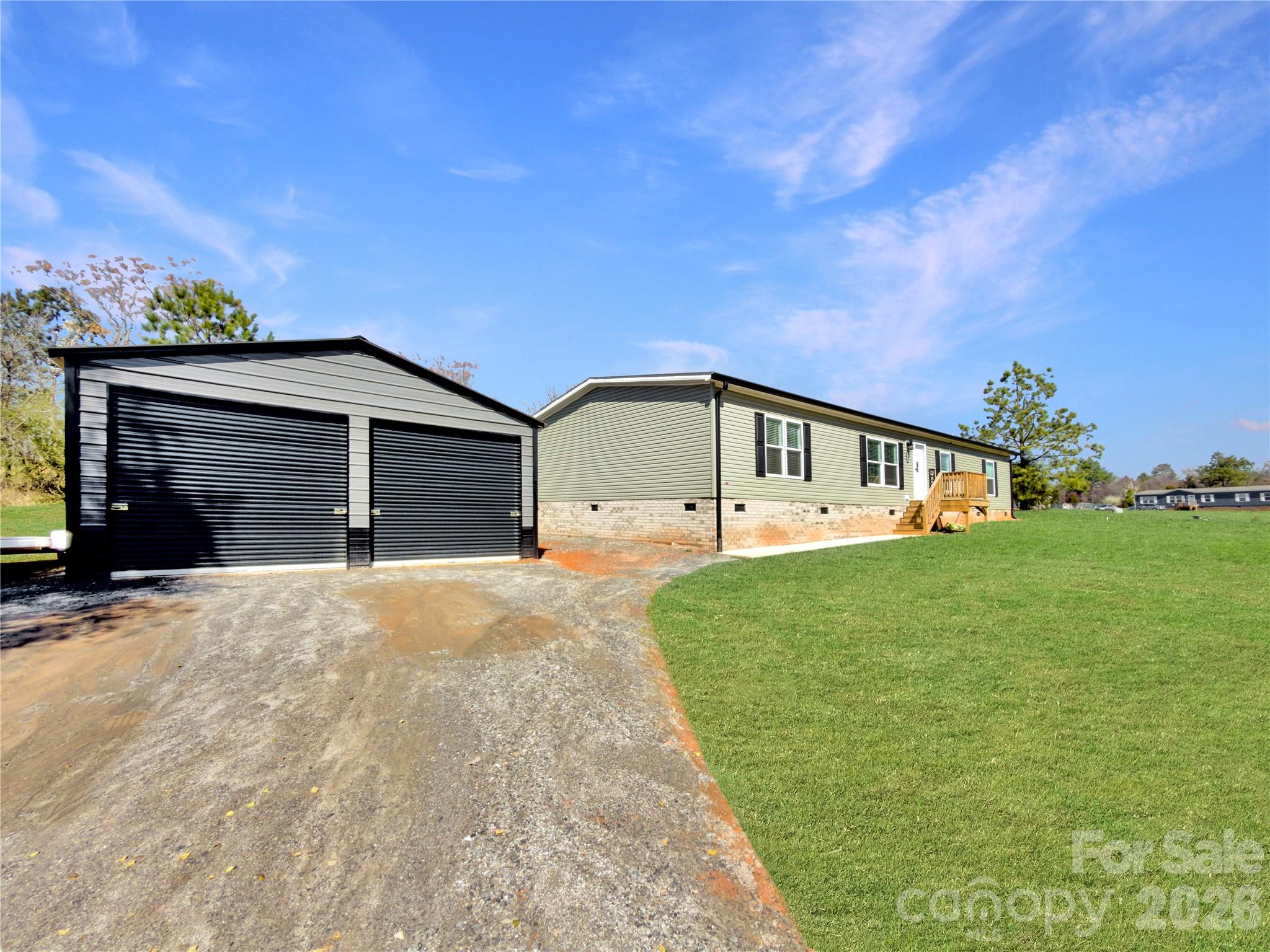 264 Fairchase Circle Stony Point, NC 28678 - Photo 3 of 24 a front view of a house with garden