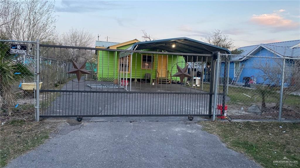 107 Esther Street Edcouch, TX 78538 - Photo 3 of 9 View of gate at dusk