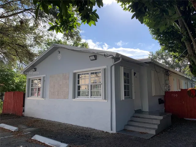 a house with trees in the background