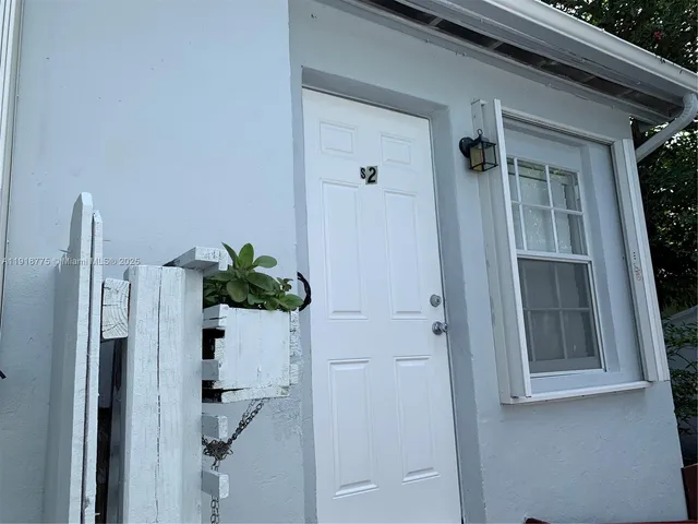 a bathroom with a shower and a mirror