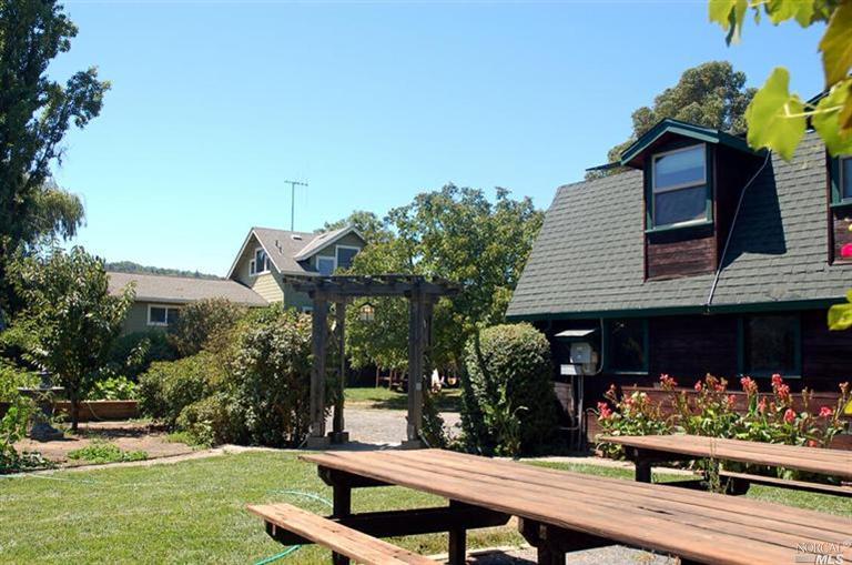 21225 Petray Lane Geyserville, CA 95441 - Photo 1 of 1 a view of a house with backyard porch and sitting area