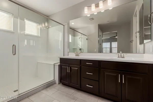 a bathroom with a sink vanity and a mirror