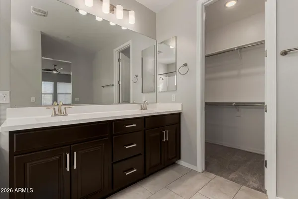 a bathroom with a double vanity sink mirror and double