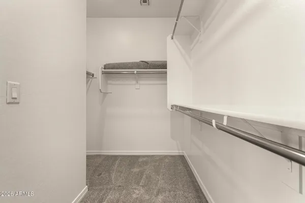 a view of an empty walk in closet
