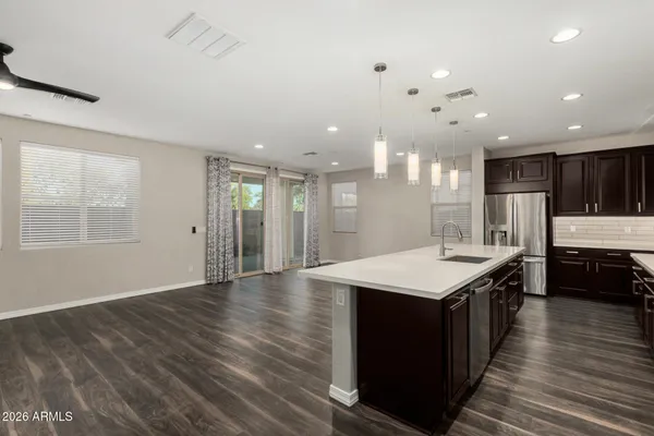 a kitchen with a stove and a refrigerator