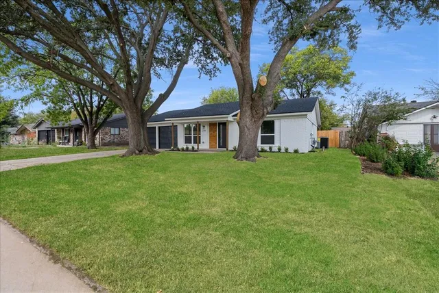 front view of a house with a yard