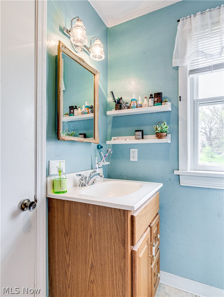 850 Ridgeview Drive Independence, OH 44131 - Photo 14 of 20 Bathroom featuring crown molding and vanity