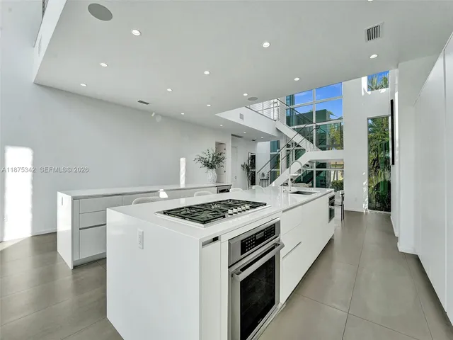 a view of a lake with boats and trees in the background