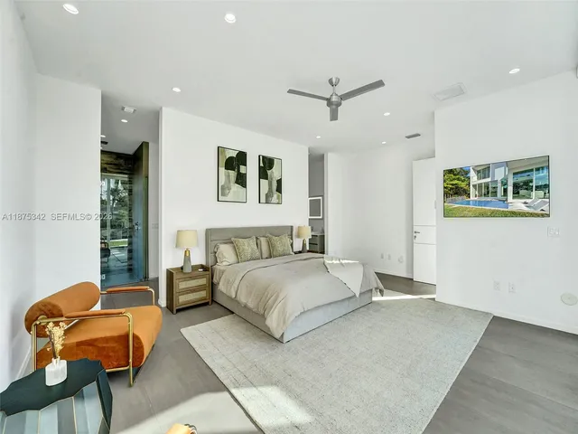 a view of a lake with boats and trees in the background
