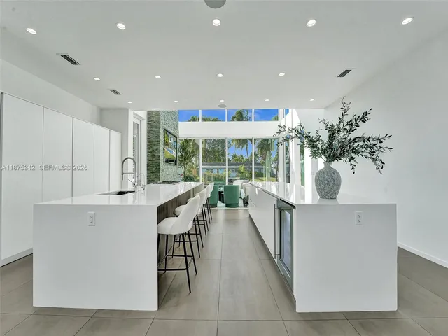 a view of a living room and balcony