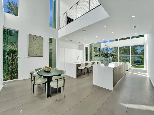 a living room with furniture a lamp and a table