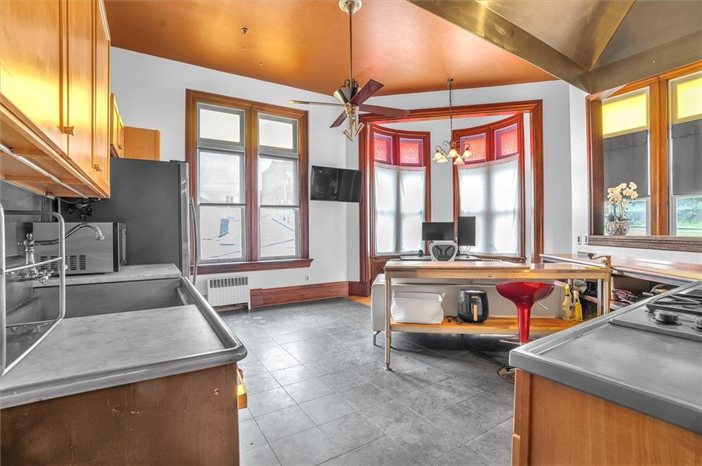 1 Pius Street, Unit B1 Pittsburgh, PA 15203 - Photo 6 of 45 a bedroom with furniture and a large window