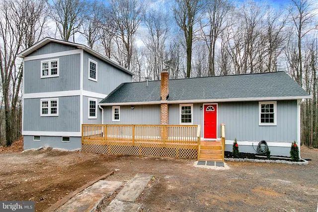 a front view of a house with garage