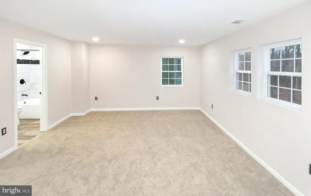 an empty room with windows