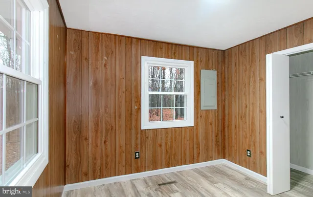a view of a room with a wooden door
