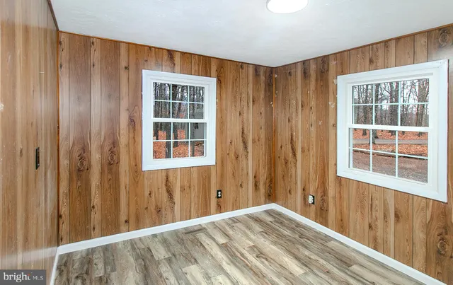 a view of a hallway with windows