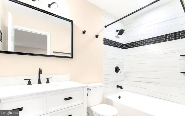 a bathroom with a bathtub and a sink