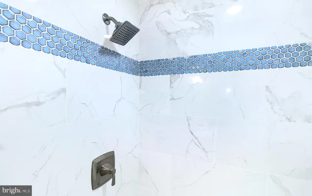 a picture of a bathroom with a shower