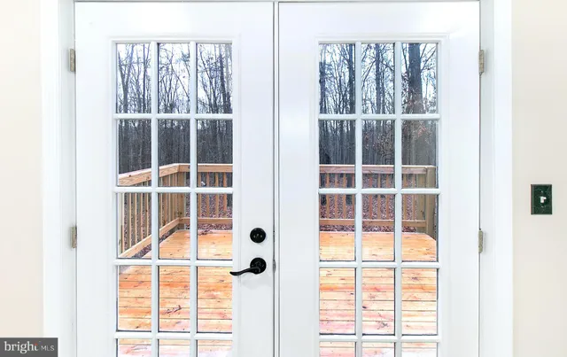 a view of a door and a window