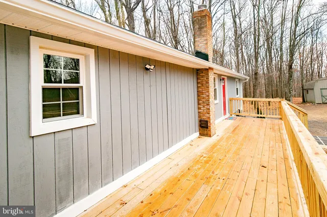 a view of backyard with a outdoor space