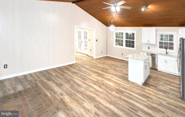 a room with a bed and a large window