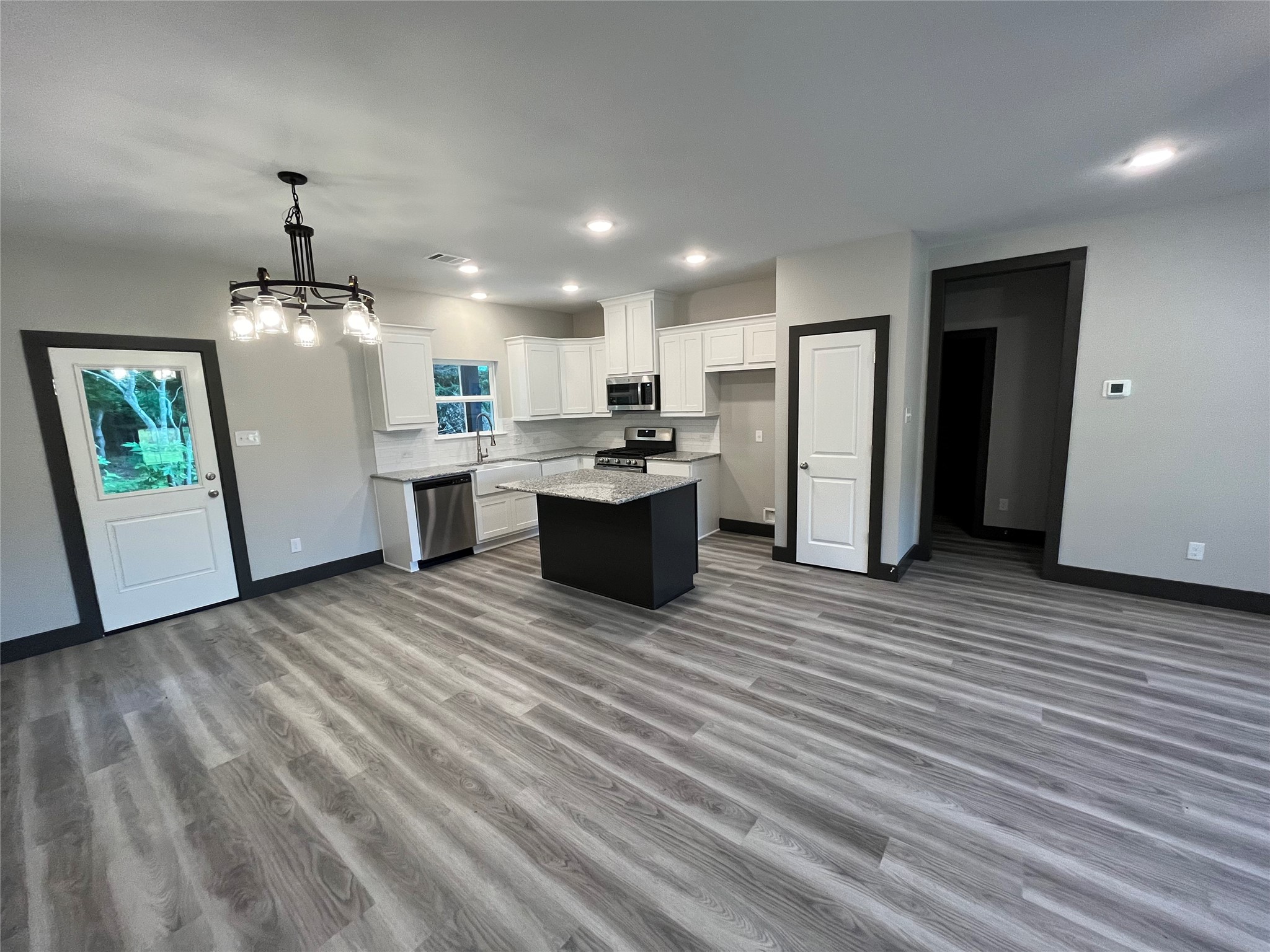 111 Heatherbrook Somerville, TX 77879 - Photo 3 of 11 a room with furniture and wooden floor