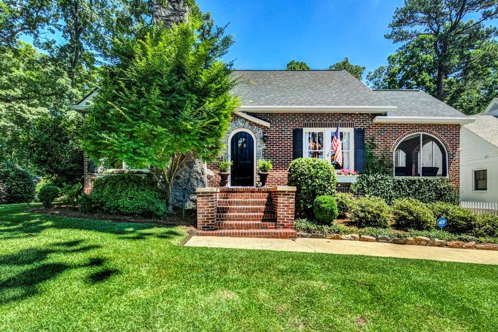 529 Collier Road Northwest Atlanta, GA 30318 - Photo 1 of 1 a front view of a house with a yard