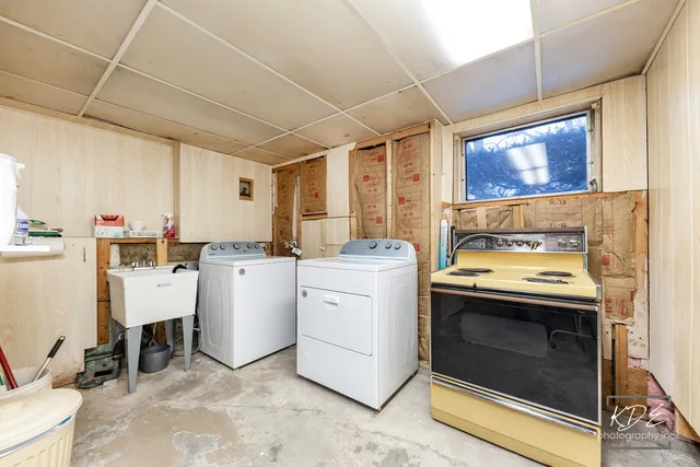 a kitchen with a stove and white cabinets