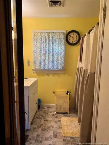 a gym room with furniture pool and a mirror