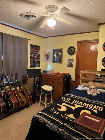 a room with furniture pool table and window