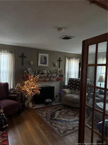 a view of a field with trees in the background