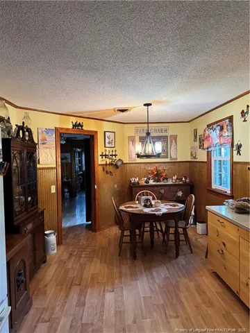 a kitchen with a table and chairs in it